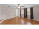 Bedroom with hardwood floors, three windows, and ceiling fan at 864 Naples Dr, Orlando, FL 32804