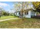 This single-story home boasts a well-maintained lawn, and lovely curb appeal on a corner lot at 864 Naples Dr, Orlando, FL 32804