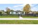 The house has a well-manicured lawn and a charming black picket fence, and lovely curb appeal at 864 Naples Dr, Orlando, FL 32804