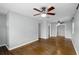 Bright living room with hardwood floors, gray walls, ceiling fans, and open layout at 864 Naples Dr, Orlando, FL 32804