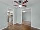 Open-concept living area with hardwood floors and a ceiling fan at 864 Naples Dr, Orlando, FL 32804