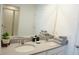 Bright bathroom featuring double sinks, granite countertops, and neutral decor at 8914 Caroline Bay Ct, Kissimmee, FL 34747