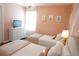 Charming bedroom with two twin beds, pink accents, and princess-themed artwork, creating a whimsical space at 8914 Caroline Bay Ct, Kissimmee, FL 34747