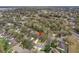 An aerial view of a residential neighborhood, showing rooftops, mature trees, and curved streets at 892 Cool Springs Cir, Ocoee, FL 34761