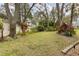 Lush backyard landscaping with mature trees and vibrant plantings provides a serene setting for outdoor enjoyment and privacy at 892 Cool Springs Cir, Ocoee, FL 34761