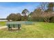 A neighborhood basketball court next to a bench overlooking the nearby lake at 892 Cool Springs Cir, Ocoee, FL 34761