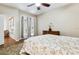 Bright bedroom features french doors, a dresser, and hardwood flooring at 892 Cool Springs Cir, Ocoee, FL 34761