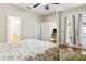 Spacious bedroom with French doors and views to the outdoor patio at 892 Cool Springs Cir, Ocoee, FL 34761