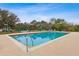 A community pool with lounge chairs and playground, creating an inviting space for recreation and relaxation at 892 Cool Springs Cir, Ocoee, FL 34761