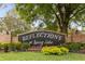 Elegant 'Reflections at Spring Lake' community sign with brick pillars and colorful landscaping at 892 Cool Springs Cir, Ocoee, FL 34761