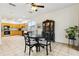 Open-concept dining area with an adjacent kitchen and access to the outdoors at 892 Cool Springs Cir, Ocoee, FL 34761
