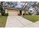Well-maintained single-story home with attached garage, lush lawn, and inviting curb appeal at 892 Cool Springs Cir, Ocoee, FL 34761