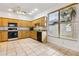 Spacious kitchen with light cabinets, granite countertops, and tiled flooring at 892 Cool Springs Cir, Ocoee, FL 34761