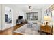 Cozy living room with hardwood floors, neutral color palette, and natural light at 892 Cool Springs Cir, Ocoee, FL 34761