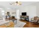 Living room featuring a hardwood floors, ceiling fan, and a rocking chair at 892 Cool Springs Cir, Ocoee, FL 34761