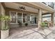 Covered patio with brick flooring, ceiling fan, and an inviting view of the backyard at 892 Cool Springs Cir, Ocoee, FL 34761