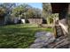 A view of the backyard with shed, lattice structure, covered area and ramp at 933 Lakehurst St, Lakeland, FL 33805