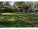 Large backyard with a shed and a covered structure at 933 Lakehurst St, Lakeland, FL 33805