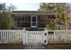House behind white picket fence with a No Trespassing sign at 933 Lakehurst St, Lakeland, FL 33805