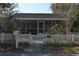 Close up of house behind white picket fence with a No Trespassing sign at 933 Lakehurst St, Lakeland, FL 33805