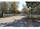 Charming home with white picket fence, landscaped yard, and a spacious driveway at 933 Lakehurst St, Lakeland, FL 33805