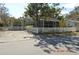 Home with an inviting screened porch and attractive white picket fence enclosing the landscaped yard at 933 Lakehurst St, Lakeland, FL 33805