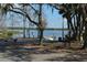 Lake access with boat ramp, dock, trailer, and a person fishing at 933 Lakehurst St, Lakeland, FL 33805