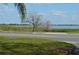 Scenic view of the lake featuring clear waters under a partly cloudy sky at 933 Lakehurst St, Lakeland, FL 33805