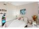 Cozy bedroom with a full size bed and organized shelving at 1075 Kensington Park Dr # 203, Altamonte Springs, FL 32714