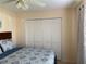 Bedroom with a ceiling fan, closet, and neutral walls at 10753 Wilderness Ct, Orlando, FL 32821