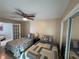 Bedroom featuring twin beds, ceiling fan and lots of natural light at 10753 Wilderness Ct, Orlando, FL 32821