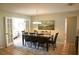 Formal dining room with a spacious table for eight and neutral tones at 10753 Wilderness Ct, Orlando, FL 32821