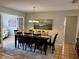 Formal dining room with a spacious table for eight and neutral tones at 10753 Wilderness Ct, Orlando, FL 32821