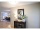 Inviting entryway featuring tile floors, console table with decor, and a view into the dining room at 10753 Wilderness Ct, Orlando, FL 32821