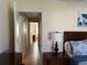 Hallway view from bedroom shows neutral walls, tile floors, and a sitting room at 10753 Wilderness Ct, Orlando, FL 32821