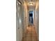 Hallway with tile flooring leading to different rooms at 10753 Wilderness Ct, Orlando, FL 32821