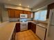 This kitchen offers ample countertop space, tile flooring, and modern appliances at 10753 Wilderness Ct, Orlando, FL 32821