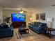 Cozy living room with comfortable seating, stylish decor, and a large screen TV at 10753 Wilderness Ct, Orlando, FL 32821