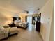 Beautiful main bedroom with tile floors, ceiling fan and French doors leading to an outdoor patio at 10753 Wilderness Ct, Orlando, FL 32821