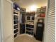 Organized walk-in closet features custom shelving and ample storage space at 10753 Wilderness Ct, Orlando, FL 32821