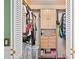 Walk-in closet with ample storage space, including shelves, drawers, and hanging rods at 1113 Lyric Dr, Deltona, FL 32738