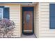 Close-up of home showcasing a charming front door with decorative glass and manicured landscaping at 1113 Lyric Dr, Deltona, FL 32738