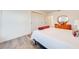 Bedroom featuring wood floors, a closet, and an orange dresser at 11604 Acosta Ave, Orlando, FL 32836