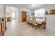 Elegant dining area adjacent to the foyer, featuring a china cabinet and seating for eight at 11604 Acosta Ave, Orlando, FL 32836