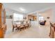 Dining room with tile floors, large table with 8 chairs, and decorative hutch at 11604 Acosta Ave, Orlando, FL 32836