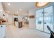 Spacious kitchen offering white cabinets, granite countertops and sliding door leading to the outdoor patio at 11604 Acosta Ave, Orlando, FL 32836