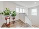 Upstairs landing area featuring natural light and laminate flooring at 11604 Acosta Ave, Orlando, FL 32836