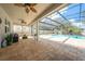 Expansive covered patio overlooking a screened pool, ideal for outdoor entertaining and relaxation at 11604 Acosta Ave, Orlando, FL 32836