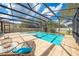 Inviting screened pool with comfortable seating, perfect for relaxing and enjoying the outdoors at 11604 Acosta Ave, Orlando, FL 32836