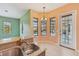 An eat-in kitchen area with a breakfast bar and stainless steel sink, with a view of the pool at 12018 Se 175Th Loop, Summerfield, FL 34491